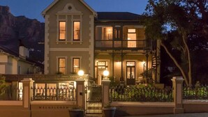 A two-story building with a prominent entrance and a balcony. - Welgelegen Boutique Hotel (Gardens)