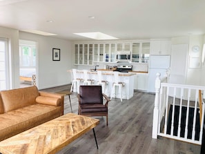 Deluxe Three Bedroom with Kitchen | Living area | 50-inch flat-screen TV with cable channels, TV, fireplace - Boardwalk Cottages (Long Beach)