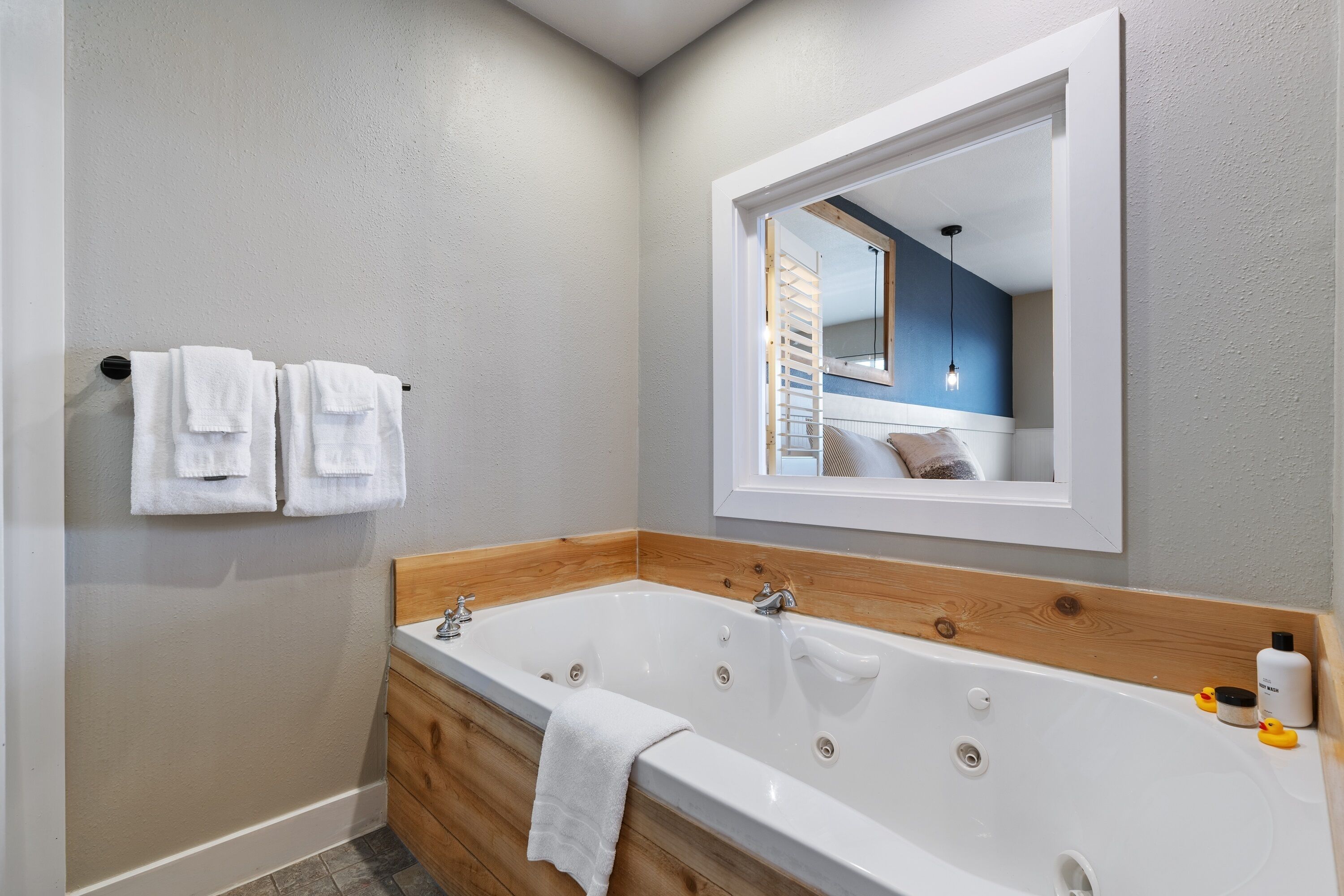 deluxe studio with jetted tub | bathroom | free toiletries, hair dryer, bathrobes, towels