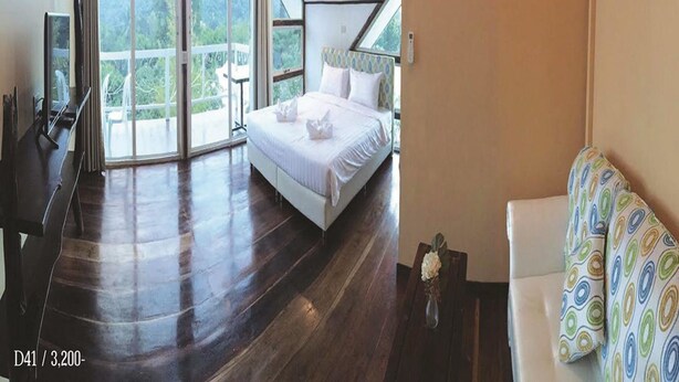 A modern bedroom with a large bed, a desk, and a sofa. - Rao Ga Khao Resort (Pak Chong)