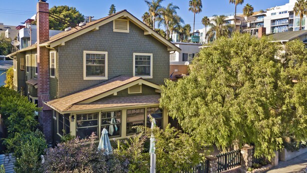 A two-story house with a large front porch, a chimney, and a garage. - Best Beach Location in Santa Monica! Our Summer Stretches Through Fall! (Santa Monica)