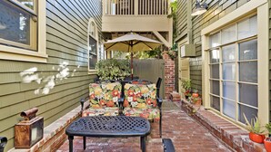 A patio with a table and chairs, a small table, and a bench. - Best Beach Location in Santa Monica! Our Summer Stretches Through Fall! (Santa Monica)