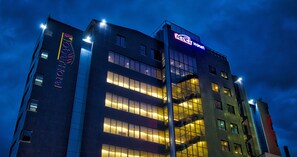 A modern hotel building with a prominent sign reading "Hotel." - Yober Hotel (Addis Ababa)