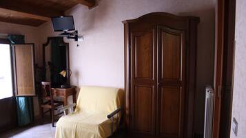 Triple Room | Living area | 22-inch flat-screen TV with digital channels, TV