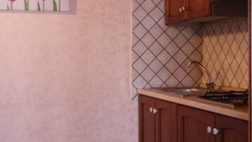 Triple Room | Private kitchen | Fridge