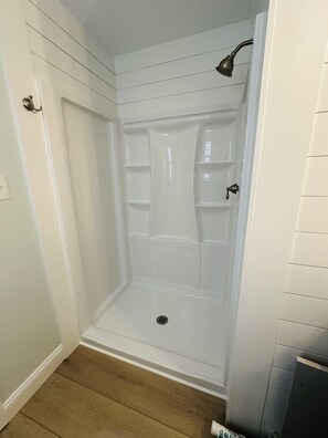 Combined shower/tub, hair dryer, towels, soap