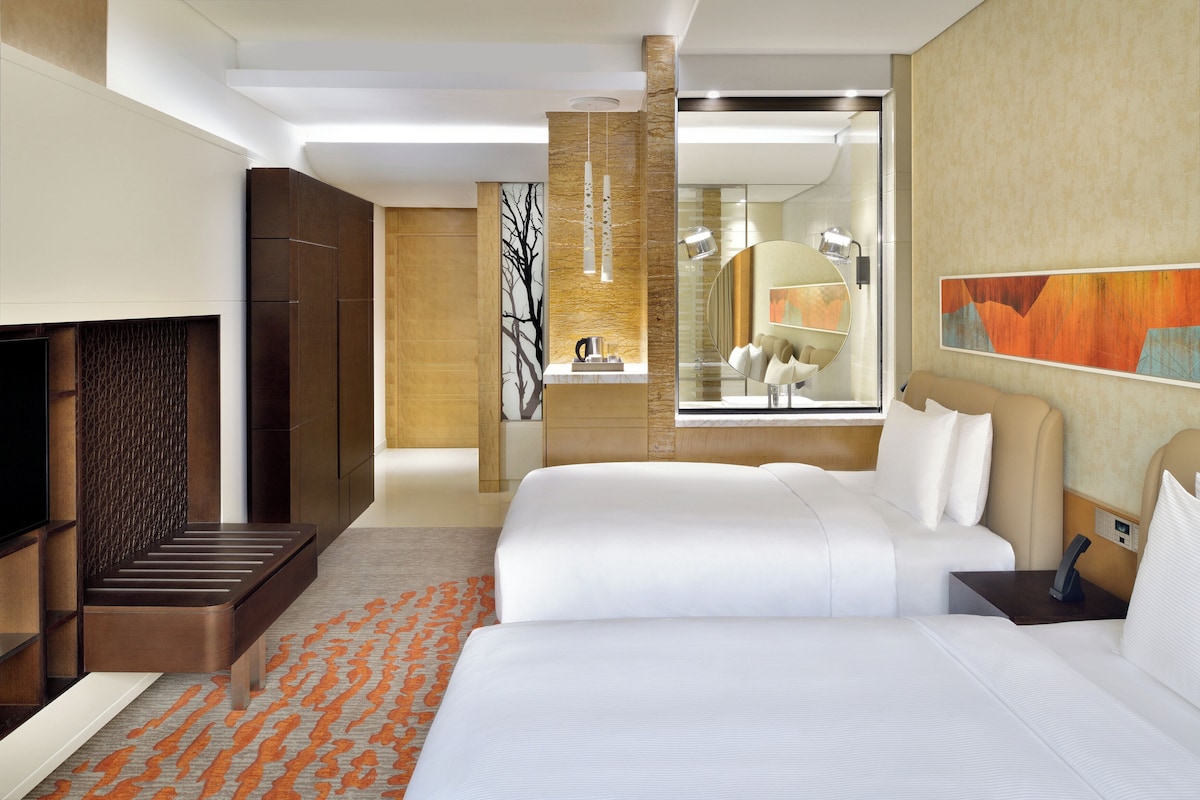 Premium bedding, down duvets, pillow-top beds, in-room safe