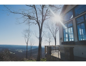 Enjoy a serene view of the surrounding hills and valley from this peaceful outdoor space.