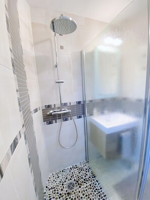 Shower, hair dryer, towels, soap