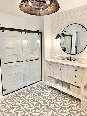 Shower, hair dryer, towels, toilet paper