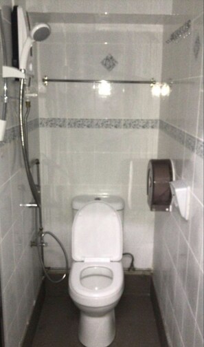 Shower, hair dryer, slippers, towels