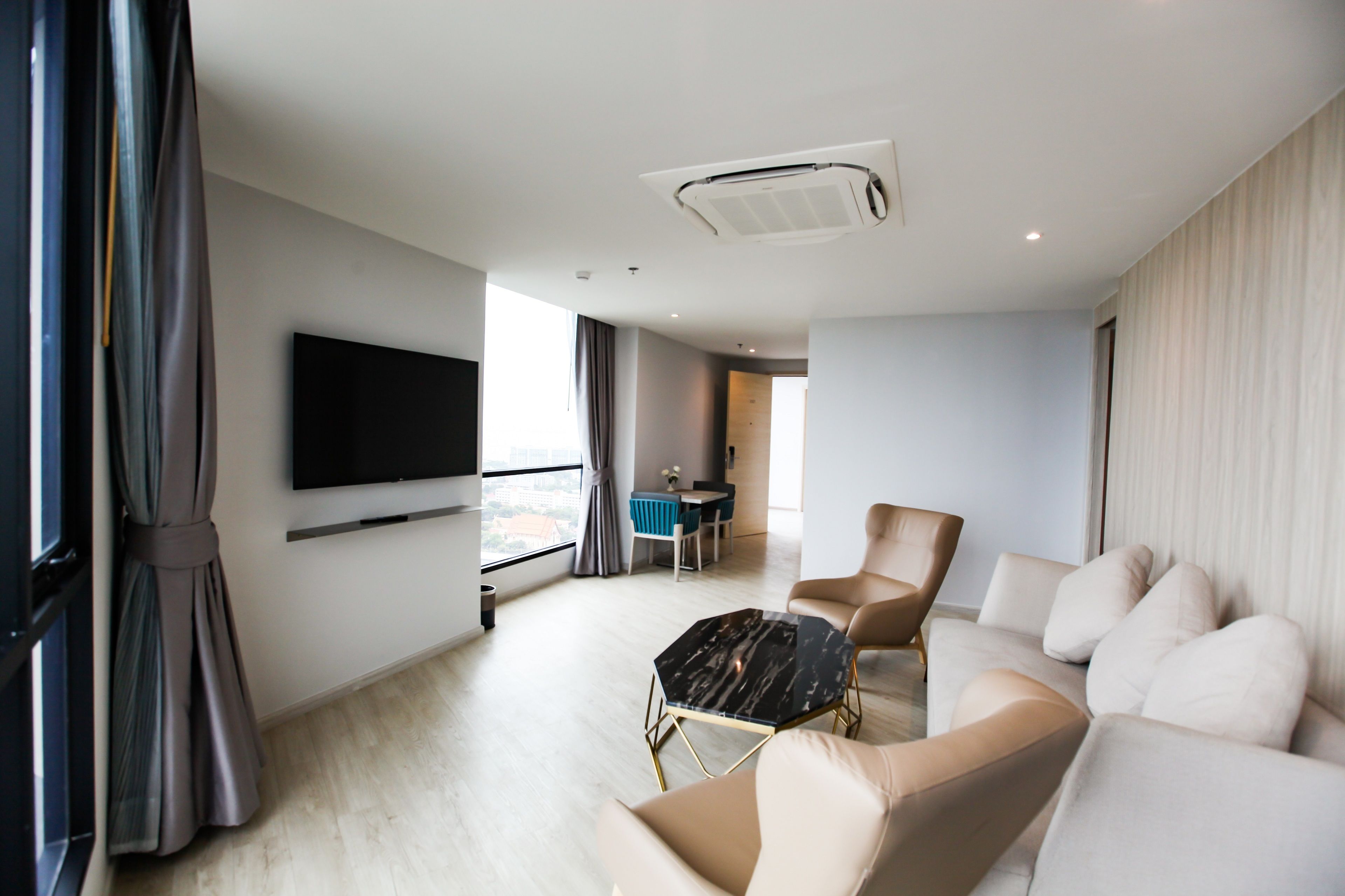 one bedroom ocean suite with bathtub | living area | 49-inch flat-screen tv with cable channels, tv