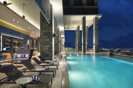 Outdoor pool, open 6:00 AM to 10:00 PM, sun loungers, lifeguards on site