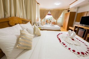 Family Room | Minibar, in-room safe, desk, blackout drapes - Ten Mile Hotel (Yangon)