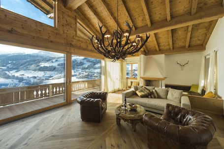 Deluxe Chalet, 5 Bedrooms, Pool Access, Mountain View | Living room | Flat-screen TV, DVD player