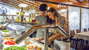 A buffet area with various food items and condiments. - Hotel Patria (Štrba)