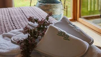 Relax in a serene garden-view room with a bathtub and comfortable amenities.