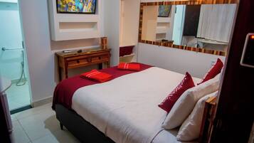 Suite com acessibilidade para mobilidade reduzida | Frigobar, Wi-Fi de cortesia, roupa de cama