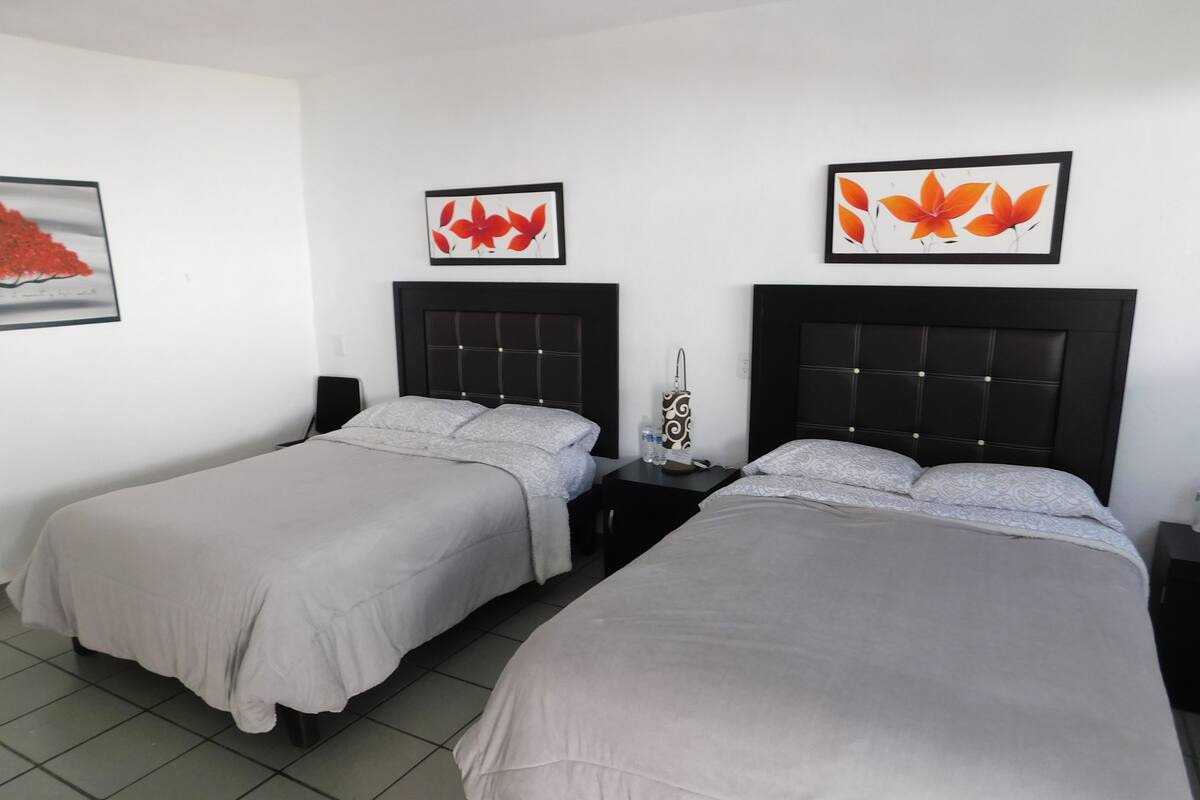 Family Quadruple Room, 2 Double Beds, Accessible, Pool Access | Individually decorated, individually furnished, iron/ironing board
