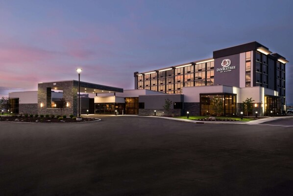 A modern hotel with a prominent DoubleTree logo, featuring a spacious entrance and a well-lit facade. - Doubletree by Hilton Lafayette East, IN (Lafayette)