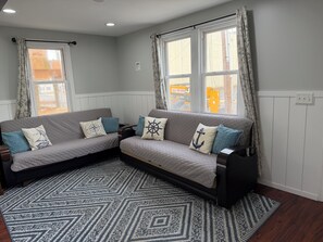 Signature Apartment, 2 Bedrooms, Kitchenette, Ground Floor Unit 1 | Living area | 40-inch flat-screen TV with cable channels, TV - JD Apartments (Seaside Heights)