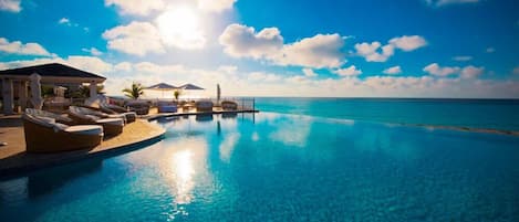 Outdoor pool, pool umbrellas, sun loungers