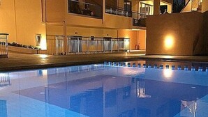 A swimming pool with a tiled floor and a red ball in the foreground. - Gerona Mare (Platanias)