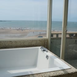 Deluxe Suite, 1 King Bed, Balcony, Beach View | Bathroom | Shower, rainfall showerhead, free toiletries, hair dryer