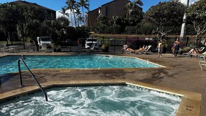 A pool area with a hot tub and lounge chairs. - Time Beach @ Grand Van Kleef  (Kihei)