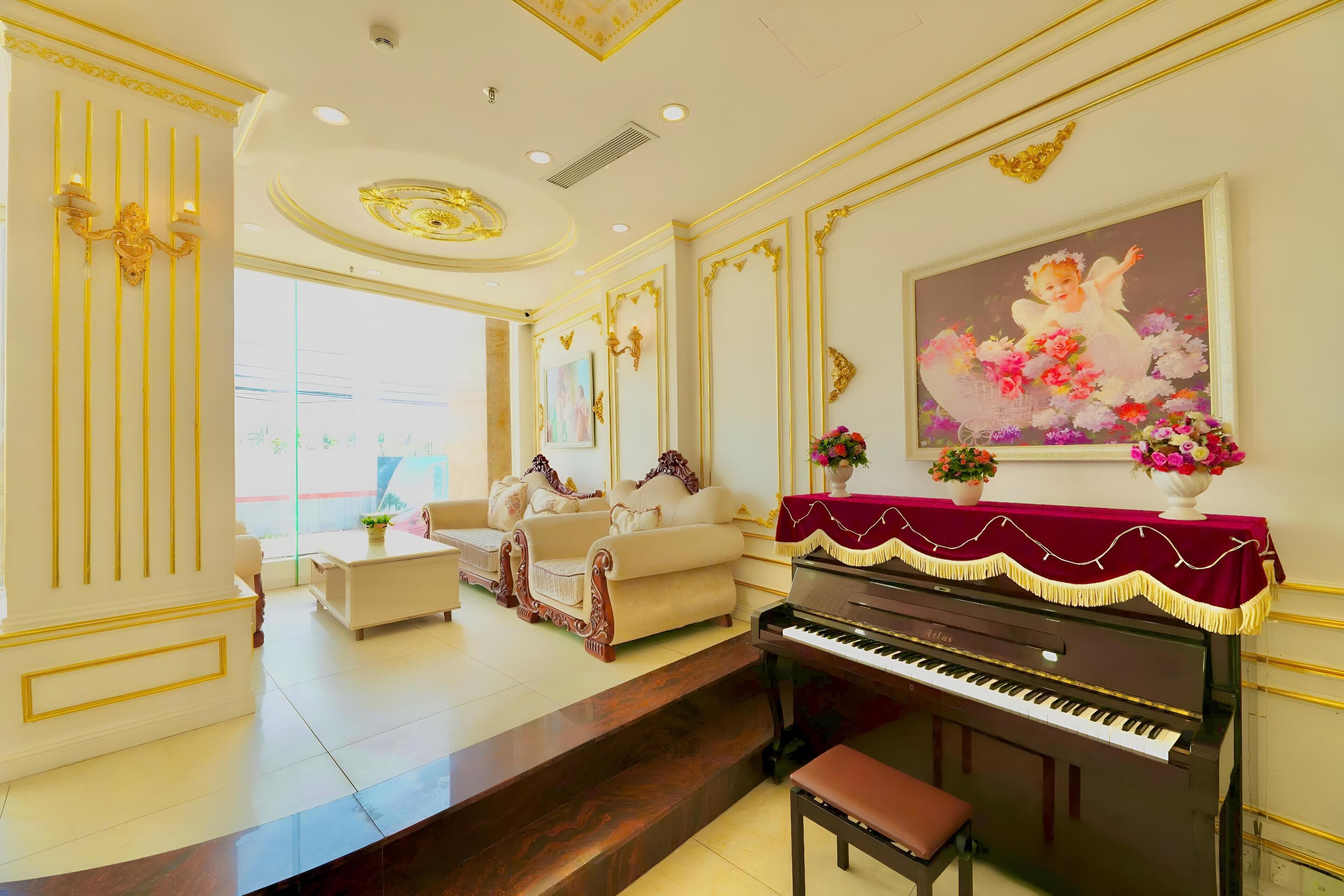 A grand living room with a piano, sofas, and a large painting.