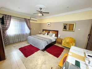 Deluxe Triple Room, 1 King Bed, Ensuite, Garden View | Premium bedding, in-room safe, individually furnished, desk - Eden Vale Hotel & Executive Training Cen (Accra)
