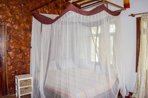 Desk, iron/ironing board, bed sheets