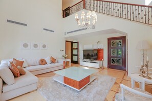 Villa, 6 Bedrooms | Living area | TV - Kennedy Towers - Signature Frond L (Dubai)