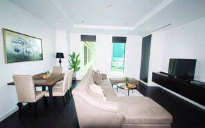 Apartment, 1 Bedroom | Living area | TV - Kennedy Towers - Limestone (Dubai)