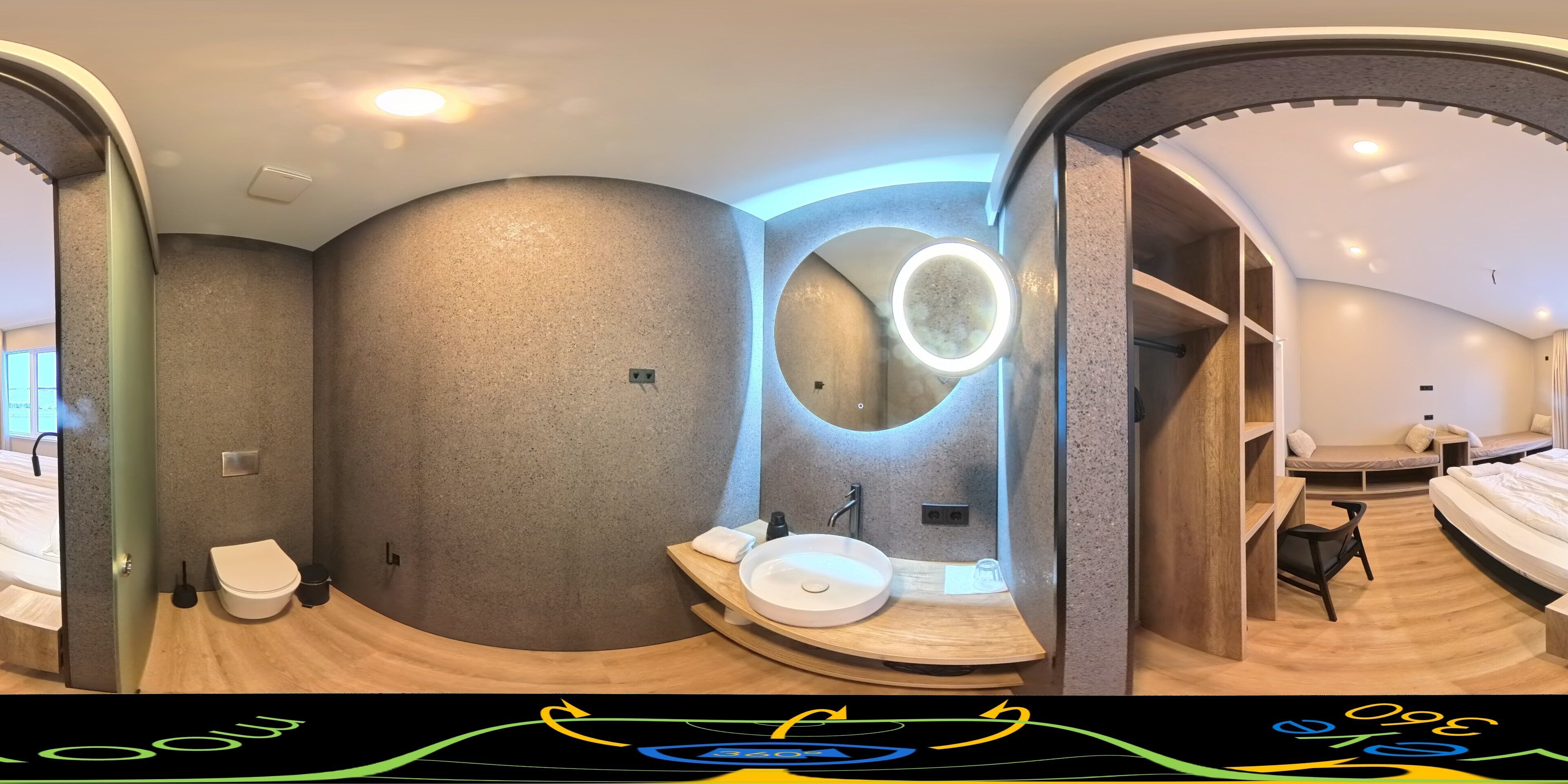A modern bathroom with a curved design, a round mirror, and a wooden vanity.
