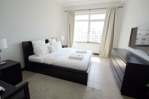 Apartment, 1 Bedroom | 1 bedroom, in-room safe, blackout drapes, iron/ironing board