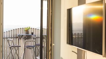 Apartment, 1 Bedroom, Terrace | Living area | Flat-screen TV