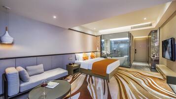 Executive Deluxe Double Room | Minibar, in-room safe, desk, blackout drapes