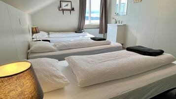 Standard Triple Room, Shared Bathroom | Blackout curtains, free WiFi, bed sheets