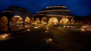 A large, circular building with multiple arched windows and a central courtyard.