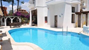 Outdoor pool, pool umbrellas, pool loungers