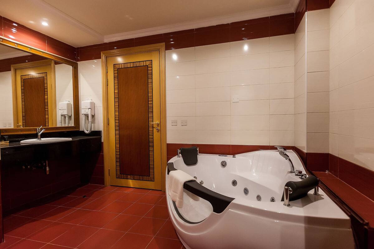Shower, free toiletries, hair dryer, slippers