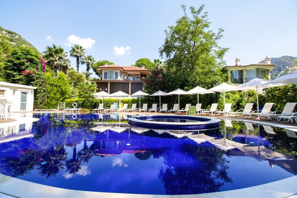 Outdoor pool, pool umbrellas, pool loungers