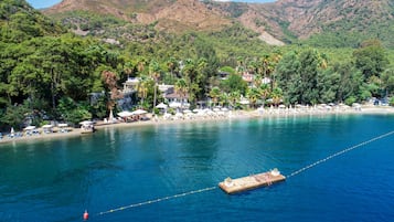 Private beach, white sand, sun loungers, beach umbrellas