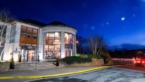 A modern hotel with a reception area, large windows, and a staircase leading to the upper floors. - Seagoe Hotel (Craigavon)