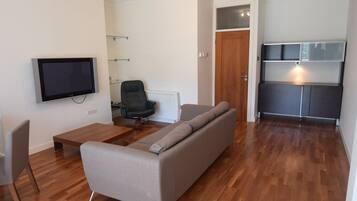 Deluxe Apartment, 2 Bedrooms, Accessible, River View | Living room | Flat-screen TV