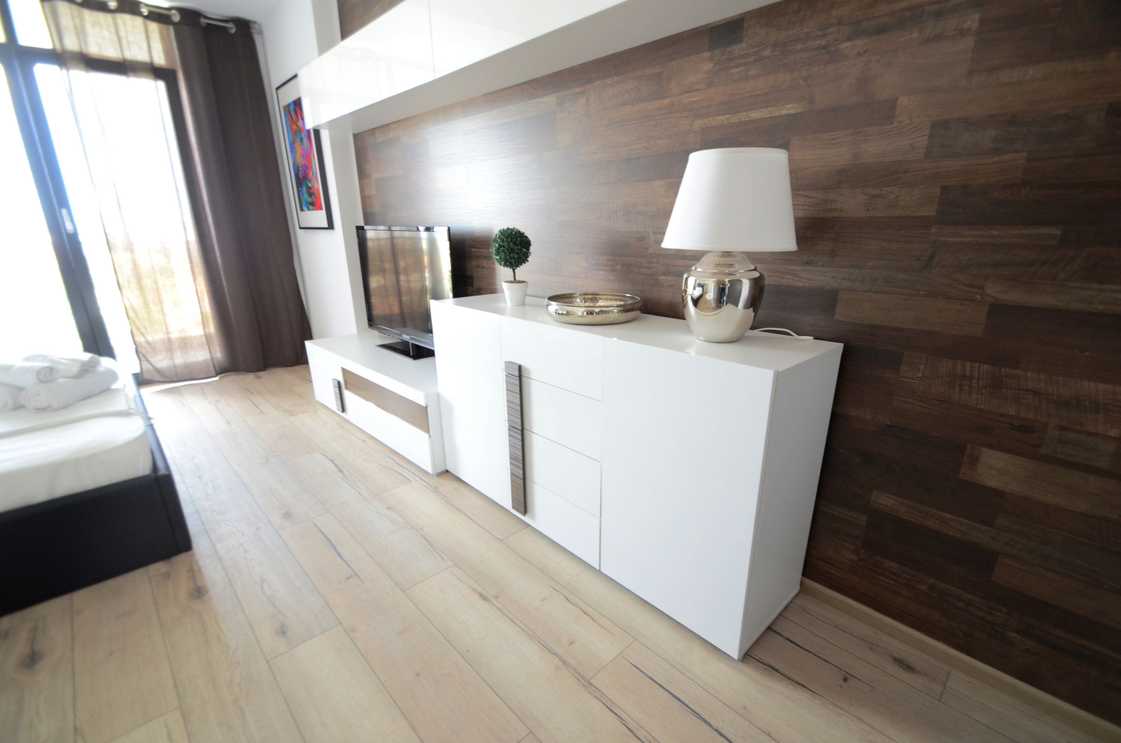 studio 58 with balcony | living area | led tv