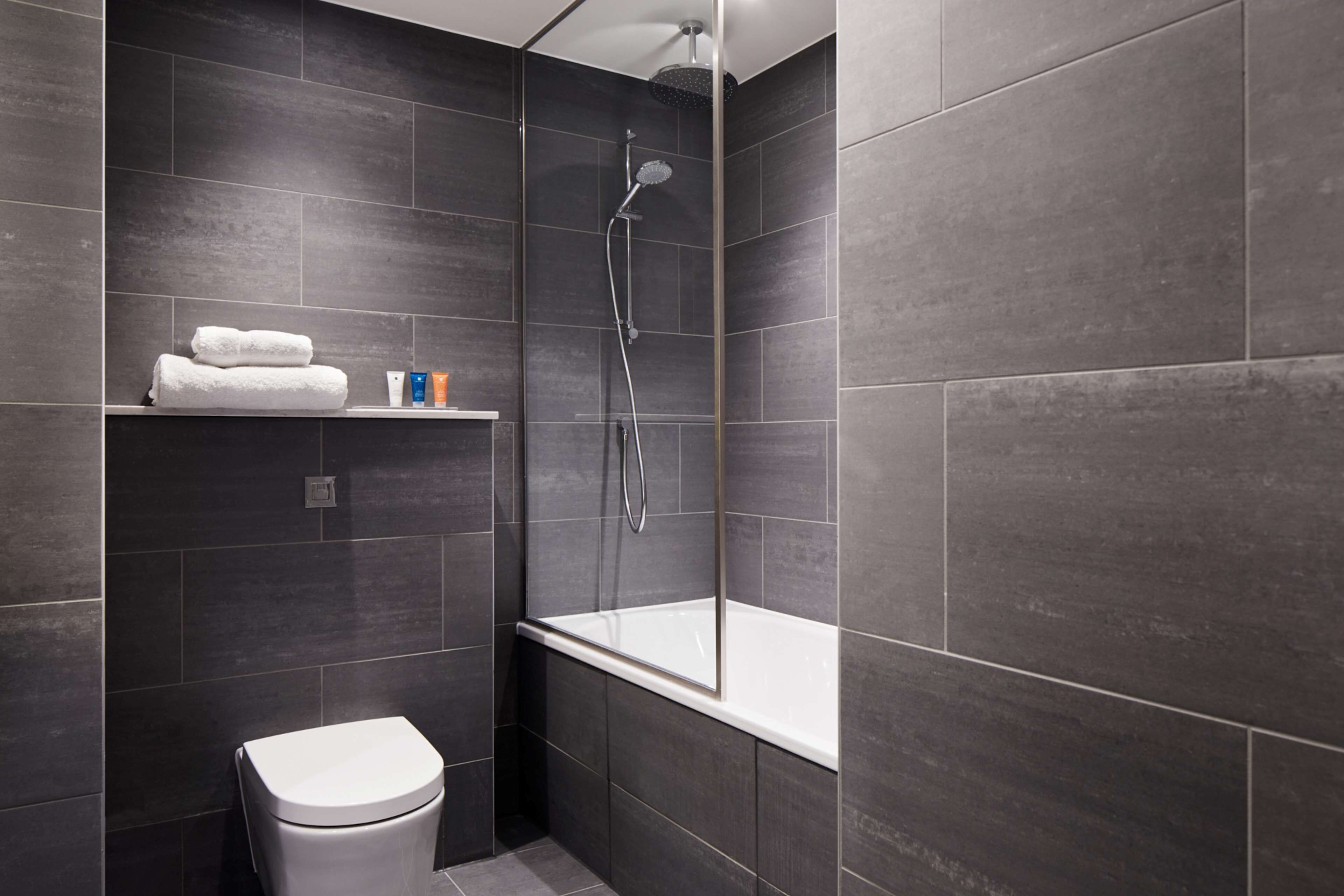 eco-friendly toiletries, hair dryer, bathrobes, slippers