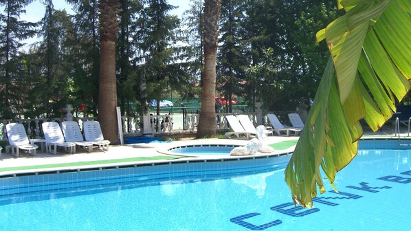 Seasonal outdoor pool, pool umbrellas, pool loungers