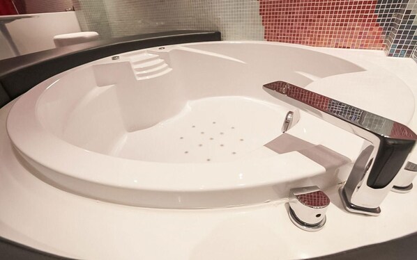 A modern bathroom with a round sink, chrome faucet, and a tiled backsplash. - Nine Star Hotel Sinchon (Seoul)